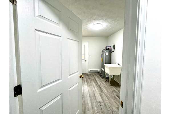 A white door is on the left of the image.